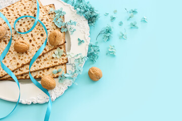 Pesah celebration concept (jewish Passover holiday) over pastel blue background