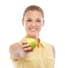 Healthy eating starts with this...A cute young teen holding out an apple while isolated on white.