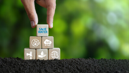 world water day concept Reduced clean renewable energy Hand placed wooden blocks with save water...