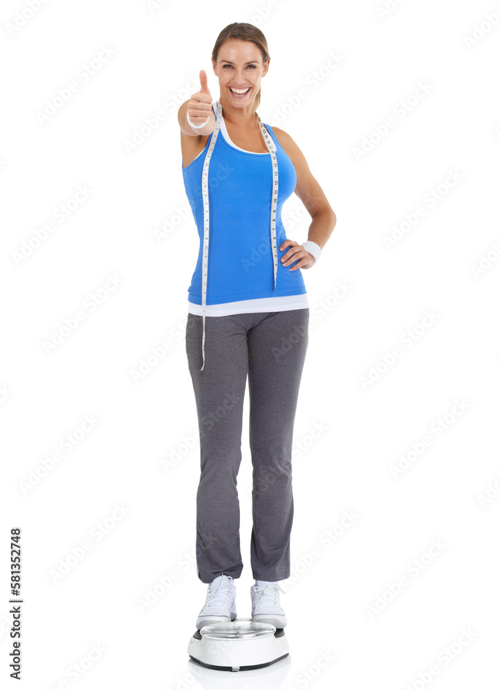 Sticker I made it, and so can you - Weight loss goals. Fit young woman giving you a thumbs up against a white background while standing on a scale.