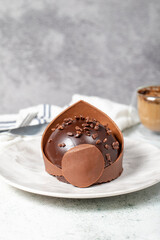 Chocolate cake. Bakery desserts. Delicious round portion cake with cream and dragee filling