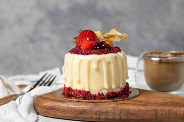 Fruit cream cake. Bakery desserts. Delicious round portion cake with strawberries and cream