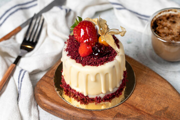 Fruit cream cake. Bakery desserts. Delicious round portion cake with strawberries and cream