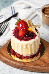 Fruit cream cake. Bakery desserts. Delicious round portion cake with strawberries and cream