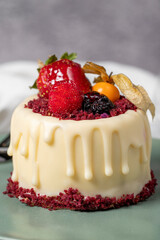 Fruit cream cake. Bakery desserts. Delicious round portion cake with strawberries and cream