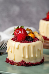Fruit cream cake. Bakery desserts. Delicious round portion cake with strawberries and cream