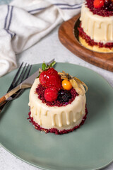 Fruit cream cake. Bakery desserts. Delicious round portion cake with strawberries and cream