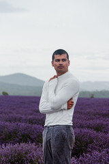 Man standing in purple lavender fields, editorial shoot, Tasmania Australia