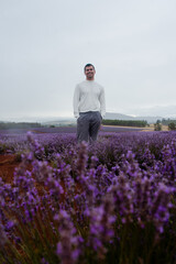 Man standing in purple lavender fields, editorial shoot, Tasmania Australia
