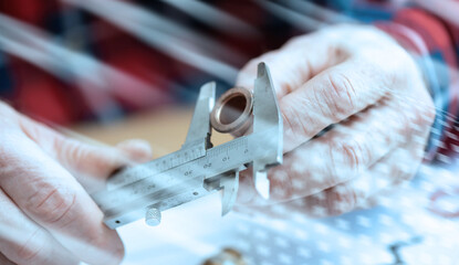 Plumber using a caliper; light effect