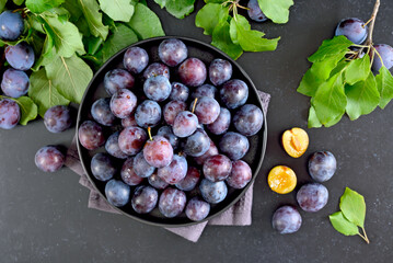 Fresh plums on plate