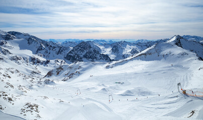 Panoramic view of Alps mountain snowy range with skiing trails, Stubai Glacier