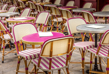 Typical table and chairs in the streets of Paris, France