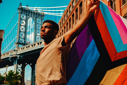 Man holding Pride flag LGTBQIA2S+