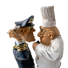 statuettes représentant un aviateur et un chef cuisinier face à face sur un fond transparent - obrazy, fototapety, plakaty