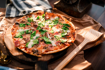 Mediterranean Pizza on wood tabletop with fresh ingredients