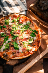 Mediterranean Pizza on wood tabletop with fresh ingredients