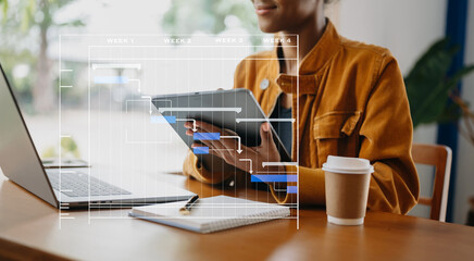 Project manager working and update tasks with milestones progress planning and Gantt chart scheduling diagram. business working with smart phone, tablet and laptop in office.