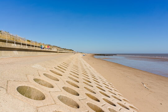 flood defenses and promenade on the beach in Skegness UK