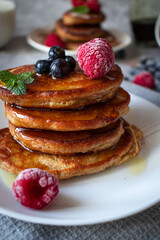 Pancakes with berries. breakfast. On a concrete background