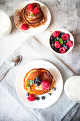 Pancakes with berries. breakfast. On a concrete background