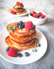 Pancakes with berries. breakfast. On a concrete background