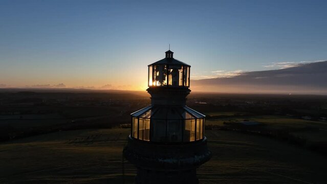 drone shot circling the top of the spire of lloyd, meath, ireland