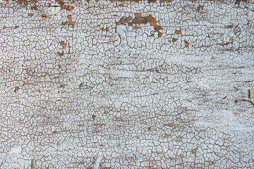 Old cracked paint on wooden board