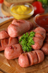 Concept of tasty food, grilled mini sausage, close up