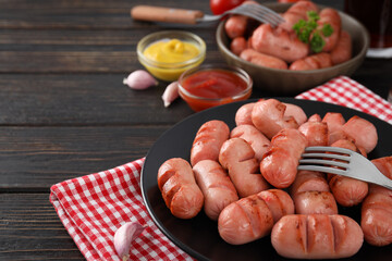 Concept of tasty food, grilled mini sausage, space for text