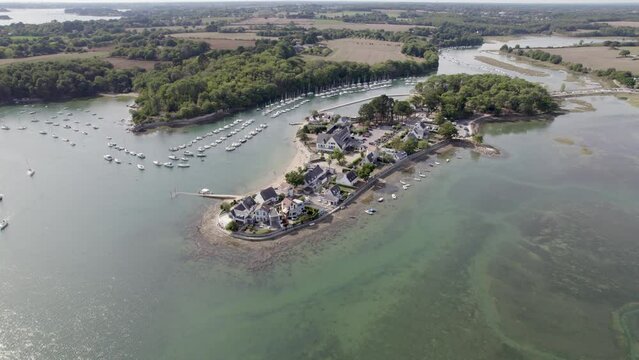 Island of Conleau in Vannes Northern France with beachfront hotels, Aerial dolly out shot