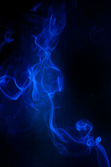 Blue smoke motion on black background.