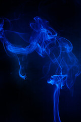 Blue smoke motion on black background.