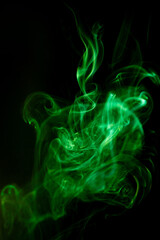 Green smoke motion on black background. - 581377980