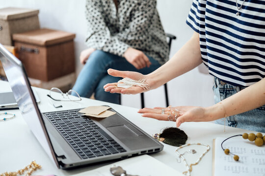 Jewelry Design: Learn the art of designing jewelry, including sketching, selecting materials, and creating prototypes. Female designer makes and design jewelry in workshop