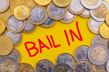 Word Bail-in, and coins around. Bank failure rescue system.
