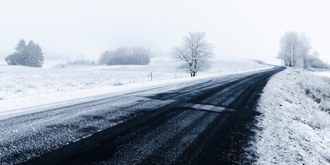 Road winding through a frozen snowy landscape