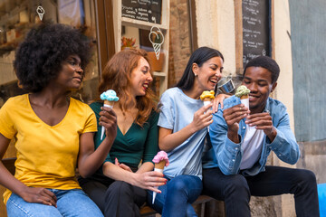 Multi-ethnic friends in an ice cream parlor eating an ice cream, summer fun, smiling