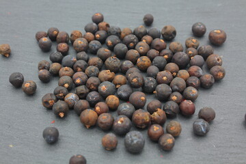 juniper berries on dark kitchen slate