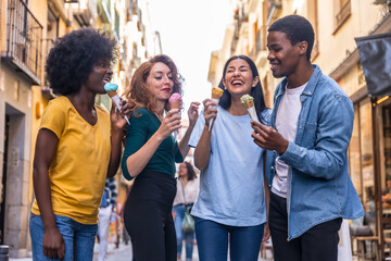 Multi-ethnic friends eating an ice cream cone, summer fun, walking down the street