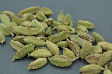cardamom seeds on dark slate