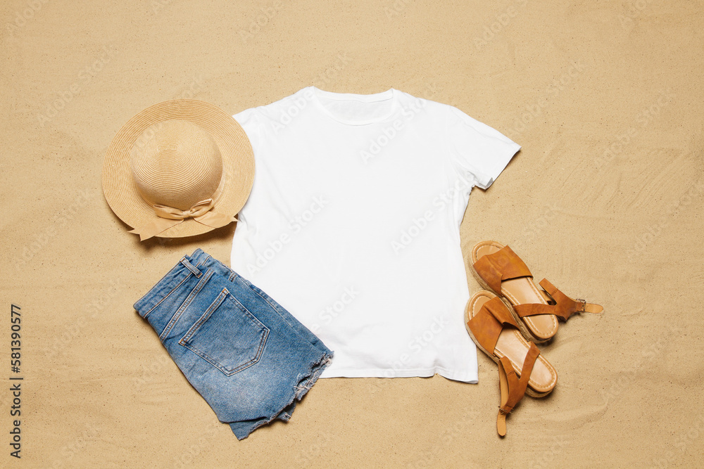 Wall mural sand beach texture background. mockup white summer t-shirt copy space. blank template woman shirt to