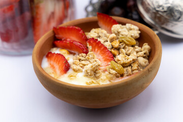 Breakfast - Healthy breakfast with oats, nuts, honey, yoghurt, raisins, 