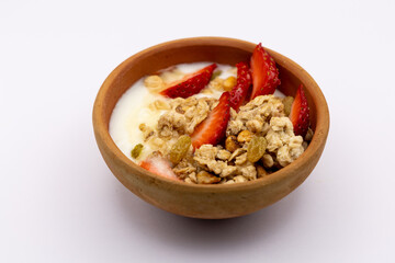 Breakfast - Healthy breakfast with oats, nuts, honey, yoghurt, raisins, 