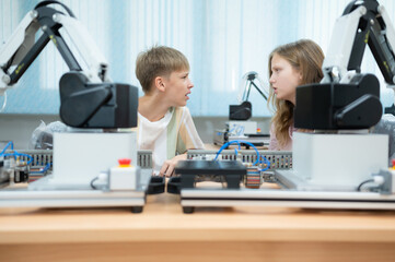 Children using the hand robot technology, Students are studying technology, which is one of the STEM courses.