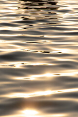 Abstract photo of water and sunrise, liquid gold
