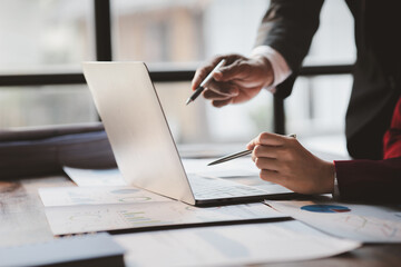 The sales department is having a monthly summary meeting to bring it to the department manager, they are verifying the correctness of the documents that are prepared before bringing in to the manager