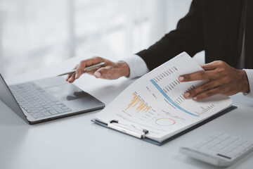 A business finance person is reviewing a company's financial documents prepared by the Finance Department for a meeting with business partners. Concept of validating the accuracy of financial numbers.
