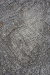 Allover neutral dark gray rough stone texture. Background of a stone surface.