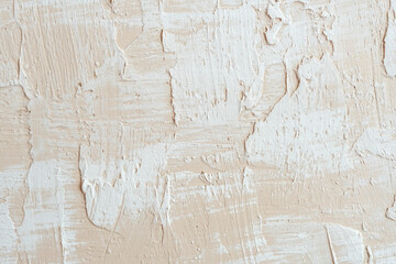 Beige decorative plaster concrete textured background. Decorative putty sample on the wall.